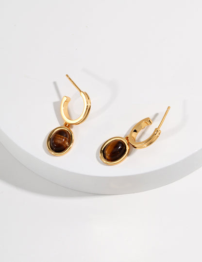 Sterling silver tiger's eye earrings Tiger's eye, also known as tiger's eye, is a gemstone with a cat's eye effect, which is regarded as the most noble symbol of the sacred stone by Indians.