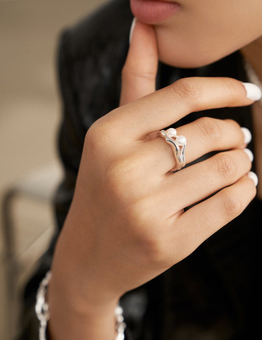 Sterling silver pearl ring with double open-ended ring design in liquid form