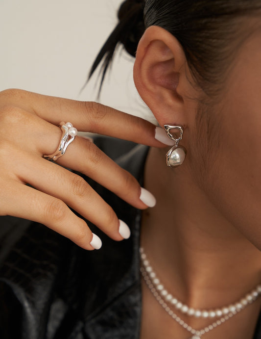 Sterling silver pearl ring with double open-ended ring design in liquid form